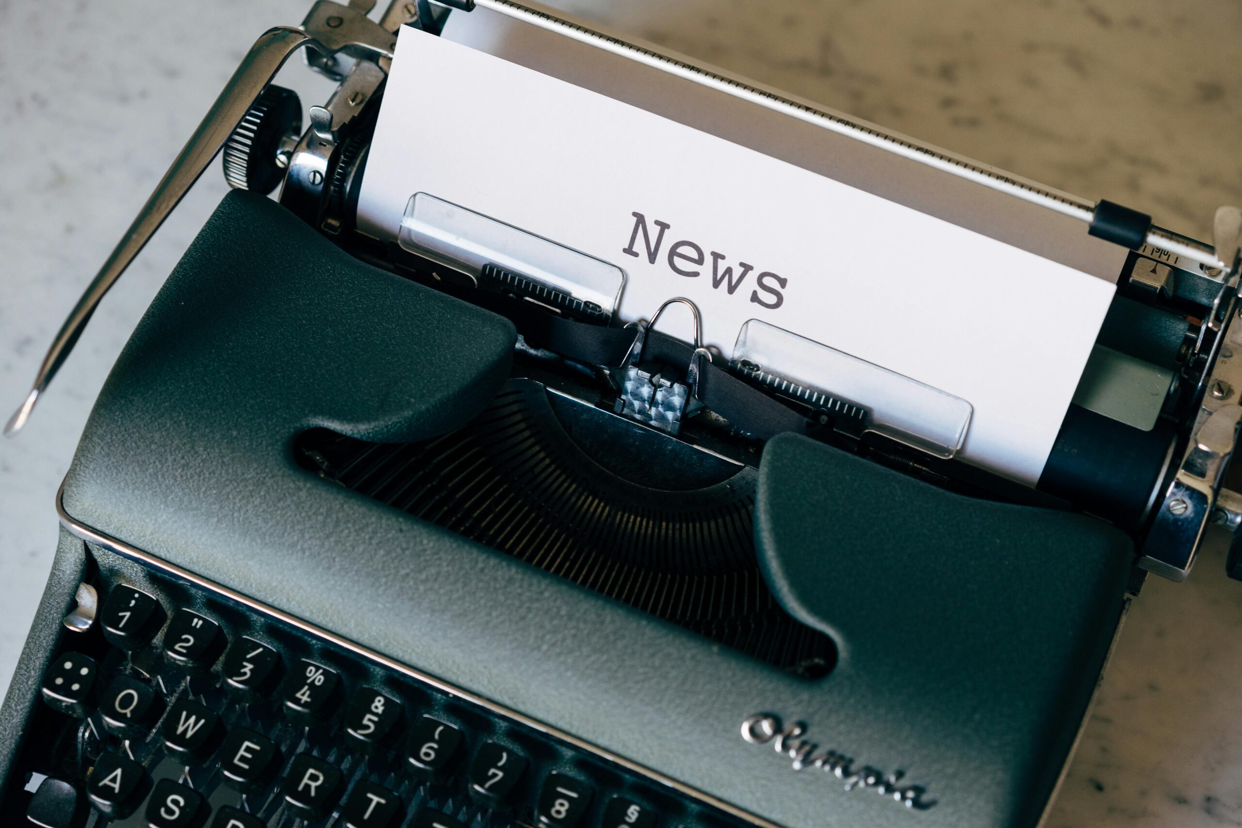 A vintage typewriter with a paper titled 